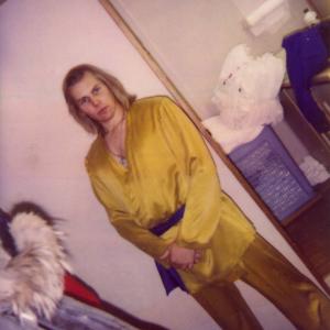 A continuity photo Polaroid of Michael Dawson in Kung Fu The Legend Continues hair and makeup trailer wearing Kwai Chang Caines ceremonial gold outfit usually worn for ritual combat  first seen on the original 70s 