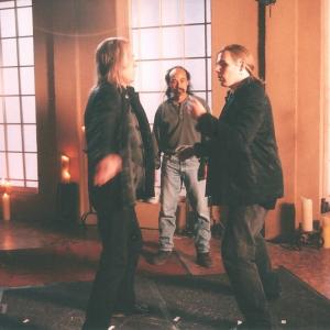 David Carradine Al Leong and Michael Dawson work out fight choreography on the set of Kung Fu The Legend Continues 1996