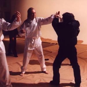 Mike Dawson (a.k.a. Michael Dawson) works out a fight scene with David Carradine and Ho Chow on the 