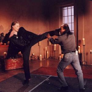 Michael Dawson stunt doubling actor David Carradine and fight coordinator Al Leong work out fight choreography together on the set of TVs Kung Fu The Legend Continues 1996