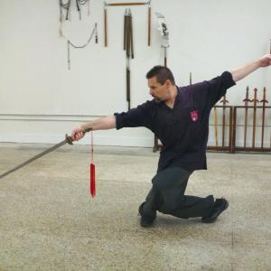 Michael Dawson with the DoubleEdged Straight Sword performing the traditional Tai Yu Sword Form from Tai Chi Chuan 2014