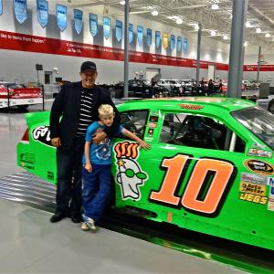 Christopher Morrow with his son Hudson discussing sponsorship opportunities with Stewart-Haas Racing.