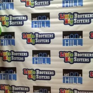 RED CARPET PREMIERE BANNER FOR LITTLE BROTHERS BIG SISTERS TV SHOW FEATURING CAROLANN COOPER