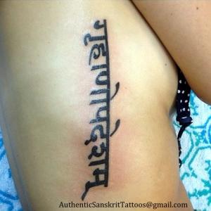 Take the lesson  Side tattoo in Sanskrit Devanagari script Translated and written in computer font in traditional style
