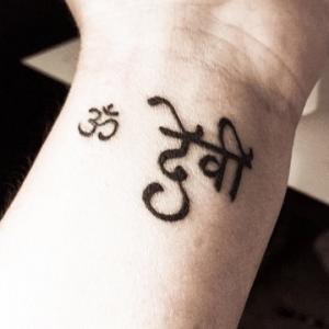 Om Devi Mother Goddess Wrist tattoo in Sanskrit Devanagari script Translated and Handwritten in traditional style with a flowy modern touch custom design Unique personal authentic