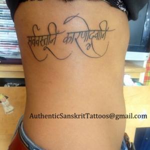 Everything happens for a reason Ribcage tattoo in Sanskrit Devanagari script Translated and Handwritten in extra curvaceous style Unique personal authentic