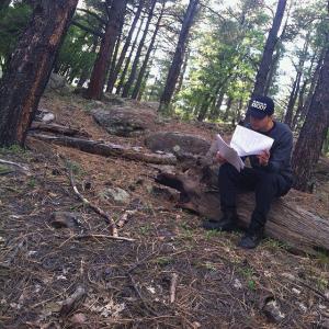 Robert Cordero caught going over his scripts for the film Real Blood within nature