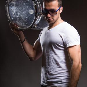 Dahov holding one of his custom made drums