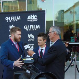 Marty Skovlund Jr and Director Matthew R Sanders being interviewed on the red carpet at the 2015 GI Film Festival in Washington DC