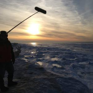 Boomoperating on an ice cliff on Lake Michigan at sunset!