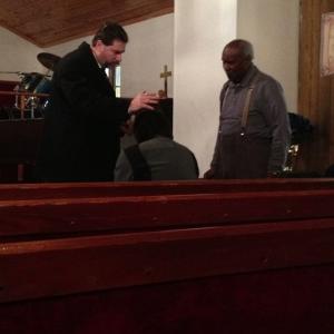 Performing an Exorcism at Memorial Deliverance Temple Long Island, NY. 2014........