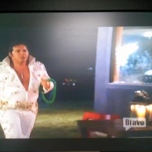 Dean Ciallella as Elvis, entering the outdoor dining area on the set of Bravo Television's Real Housewives of New York City.