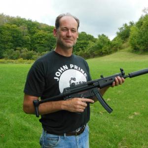 Tredd Barton with a full-auto MP5-N submachine gun.