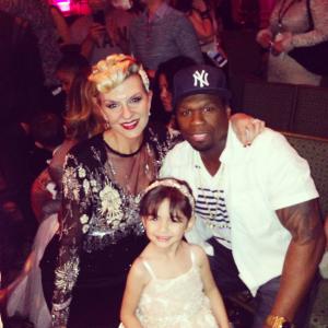Headpiece designer Betty Long What A Betty2015 runway show designed bridal flower girl head pieces and belts for Isabella couture dresses With 50 cent god daughter in the show wearing a What A Betty headpiece wwwwhatabettycom