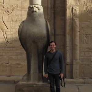 This is a picture of me next to a statue of Osiris in a temple in Egypt