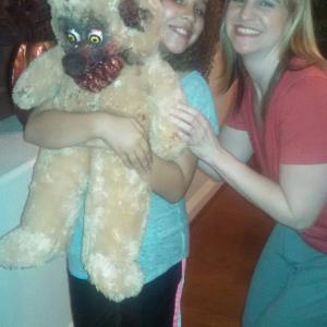 Tiana with actress Amanda Goldrick and the monster teddy bear
