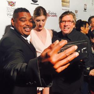 Oscar award winner Sydney Colston takes a selfie with Singer/songwriter and CEO/Founder of Forgotten Anthem Records Audrey Hendricks on the red carpet of the 58th Annual Grammy Awards