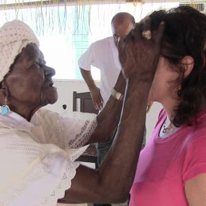 Receiving a blessing from MeMother Filhinha de IemanjOgunt then 108yearsold following an interview for Yemanj in Cachoeira Bahia Brazil