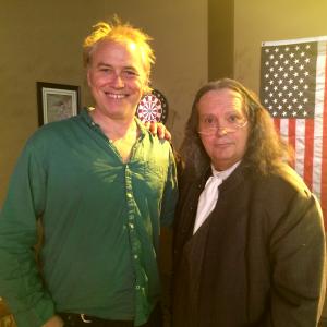 Standing next to producer Tom Stern actor Michael Q Schmidt appears as Benjamin Franklin in truTVs Six Degrees of Everything 2015