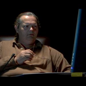 As Jonas Stubbs at the center of his electronic web in the film Piggies by Christopher Smith 2007