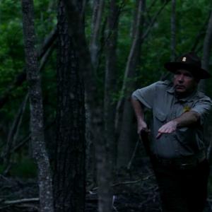 David Schifter as US Park Ranger in Finders Keepers Root of All Evil