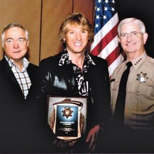 Left to Right Mike Nesbit President HDSA Michael Blakey William D Gore Sheriff of San Diego County Michael is being honored by the San Diego Sheriff Department and receiving his Honorary Sheriff badge and credentials