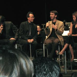 Adam Stein on stage with YoYo Ma and Andrea Morricone during a QA