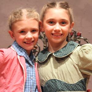 Lauren appearing as Brigitta in the Sound of Music with her sister Alexis as Marta