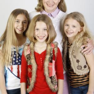 Lauren in a modeling shoot with her sisters and Grandma
