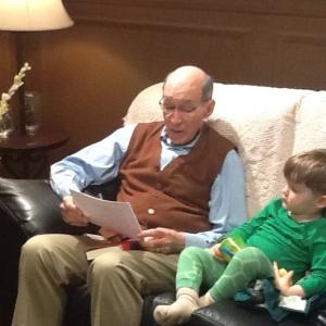 Scene from The Ride2013 in which the grandfather Pop Pop is reading to his grandson