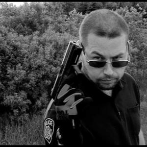 Quiver/ Trevor Zurkan Uncredited Police Officer - BG