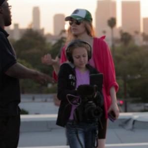 Still of Rya Emet XCalibur and Poppy in Rooftop music video