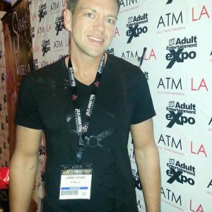 AVN Adult Entertainment Expo featuring Jamie Stone at his booth.