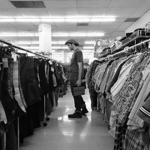 Shopping for wardrobe pieces and props at a local thrift store