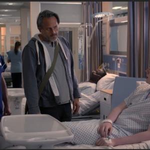 Max J Green as Stephen Holting in a scene with Alex Walkinshaw as Fletch and Mark Frost as Hugh Dogan in Holby City. Episode Title Return to Innocence S17 Ep 42 All time Episode Number 777