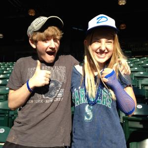 Laura with her big brother Nathan Gamble at a Mariners game