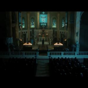 Still photo of Wayne Malm Jr. in the church scene of The Purge: Election Year