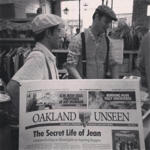 Joe Sciarrillo (left) with Matt Werner (right) vending copies of Oakland Unseen, an Onion-style fake newspaper about Oakland, California on October 4, 2013.