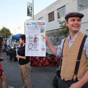 Matt Werner vending the Onion-style fake newspaper Oakland Unseen at Oakland's Art Murmur on October 4, 2013.