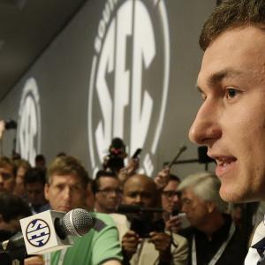 Johnny Manziel answering questions at the 2013 SEC Media Days in Birmingham. Duane Rankin was among the media present filming Manziel