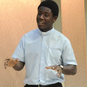 Pacharo Mzembe as Father Ezikiel in [Gwen In Purgatory]