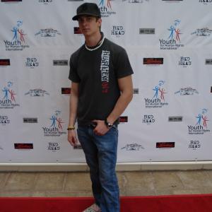 Nic Bradly red carpet runway model for youth for human rights show