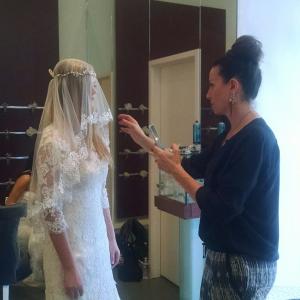 Amy going through final photo shoot prep by designer/owner Erin Cole of Erin Cole Couture Bridal.
