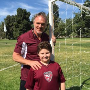 Zachary with on set coach, Brian Bosworth.
