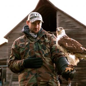 Jason L Brown with a Falcon Bella on location in Kansas