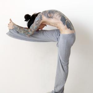 Bikram Yoga instructor pose  standing head to knee