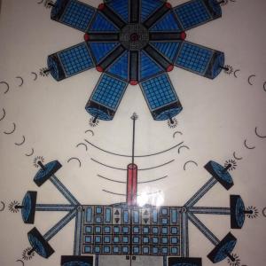 One of my designs for a satellite with moving array arms to triangulate messages across vast distances of space. Early warning Earth protection satellite with many features and laser reflectors, radar, IR, seismic, mapping, and cameras on each arm.