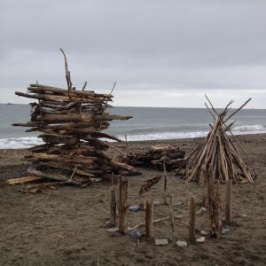 On the beach up in Alaska twenty miles from Russia making a bomb fire of drift wood.