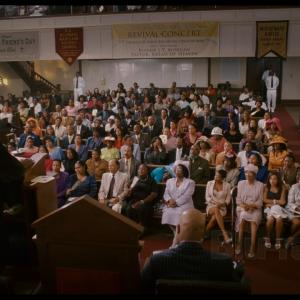 Ren'a Matthews(front row) in a scene from First Sunday starring Katt williams, Ice Cube, Loretta Devine and Tracy Morgan(2008)