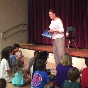 Reading Elvis the Penguin to schoolchildren in Orlando
